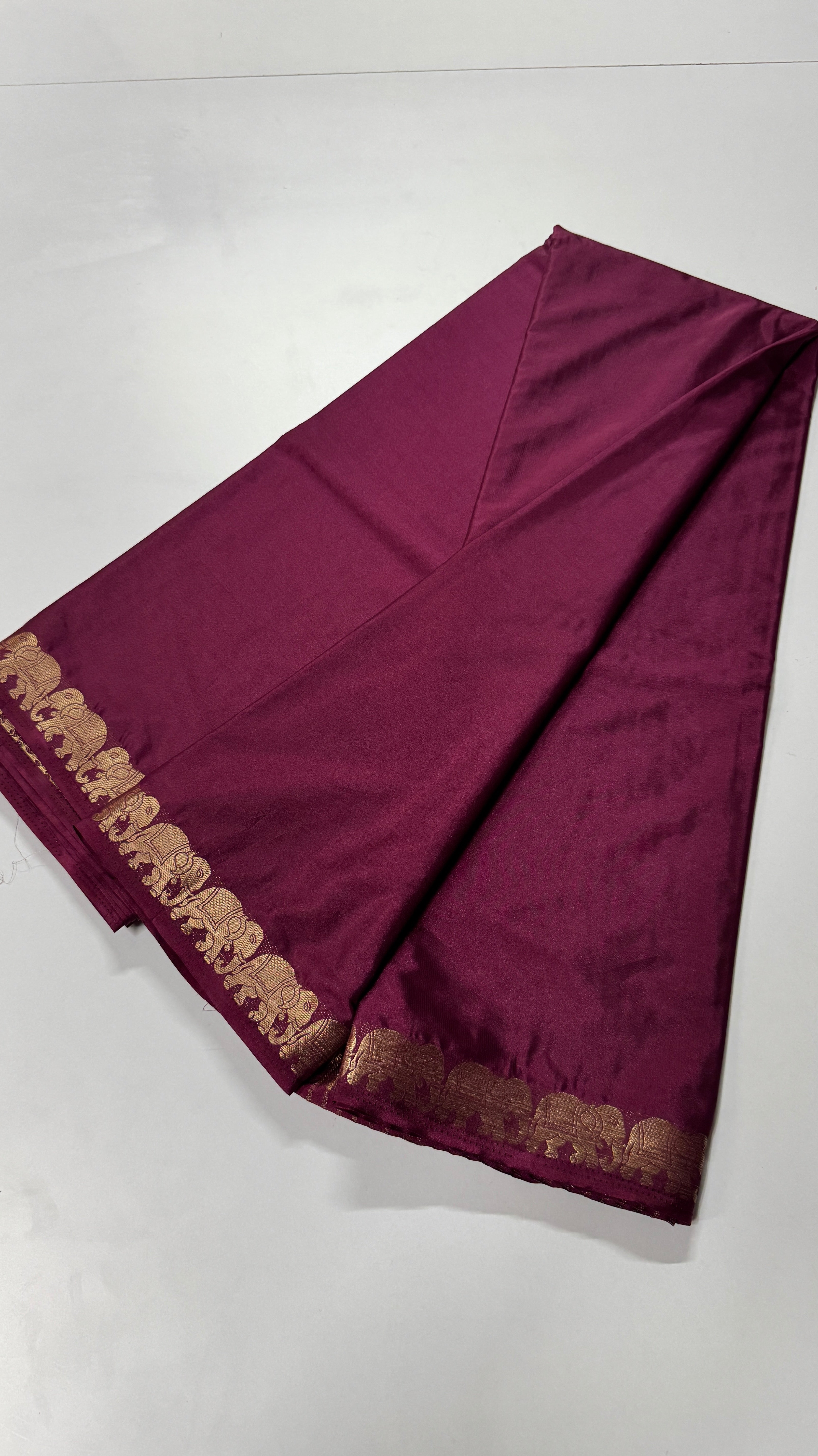 Semi Mysore Crepe Silk saree featuring a beautiful elephant border
